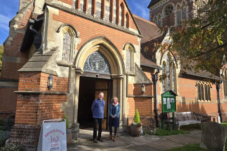 Photo of Cllr Davies and Rev Jon Hutchinson outside Holy Trinity Church