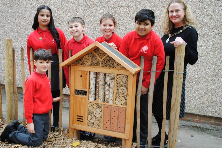 Group of children next to a bug hotel!