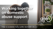 Image of a person being consoled with the text Working together on domestic abuse support