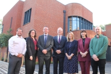 This image shows representatives of the school and council standing outside the new building