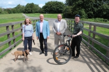 On the new shared bridge at Town Moor, left to right, is Councillor Karen Davies, Cabinet Member for Climate Change and Biodiversity, Councillor Geoff Hill, Cabinet Member for Highways and Transport, Bob Beveridge, chair of the Thames Valley Berkshire Local Enterprise Partnership, and Councillor Josh Reynolds, Cabinet Member for Communities and Leisure.