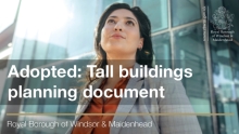 This image shows a woman standing beside a tall building. Adopted: Tall buildings planning document.