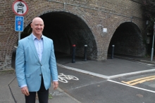 Cllr Geoff Hill with the widened cycle tracks under the railway arches at the end of Barry Avenue, which can be used by new larger bikes, such as adapted and cargo bikes