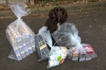 Sniffer dog Yoyo with the seized items