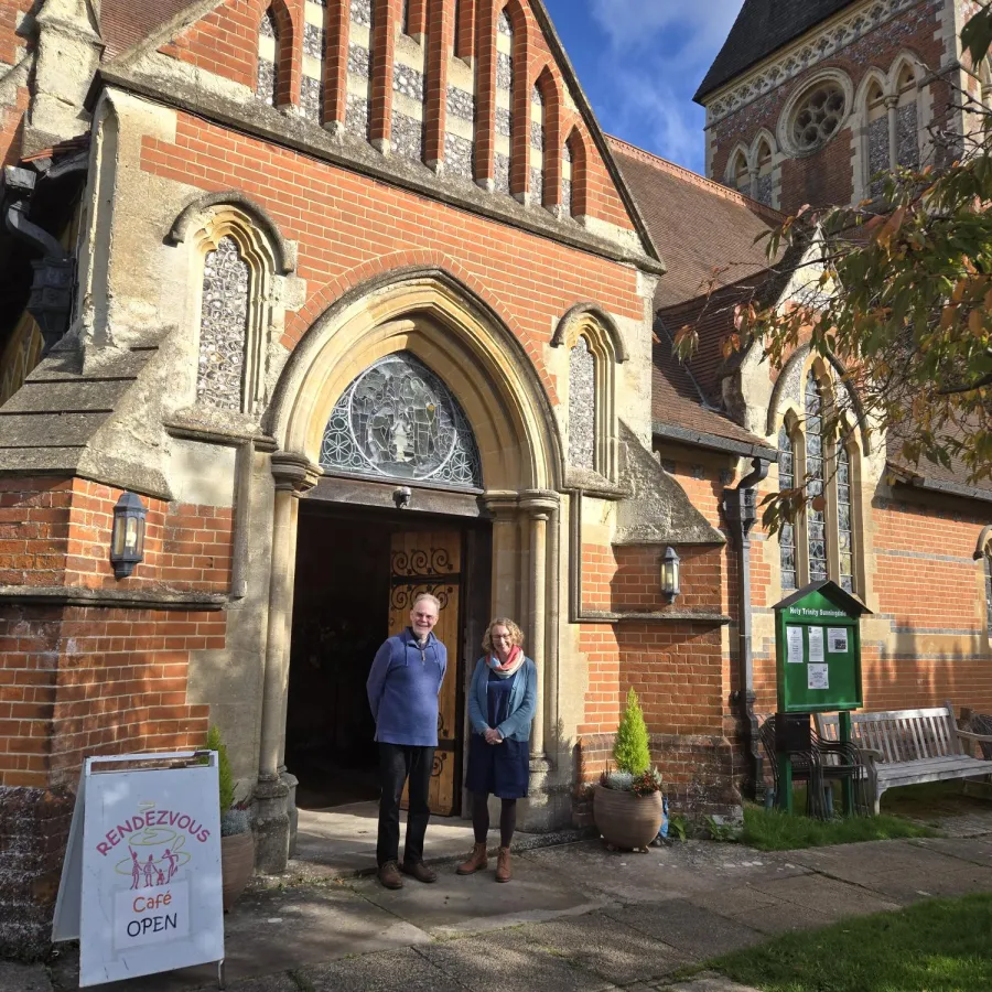 Photo of Cllr Davies and Rev Jon Hutchinson outside Holy Trinity Church