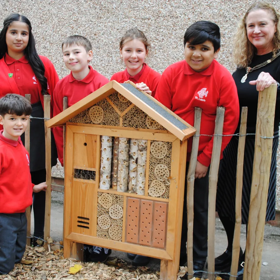 Group of children next to a bug hotel!